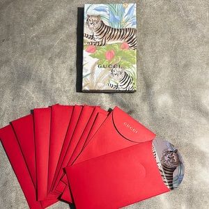 Gucci tiger box with 10 red envelopes.